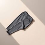 Flat lay of black high waisted leggings scrunch legging in Heather Grey, neatly folded on a neutral surface.