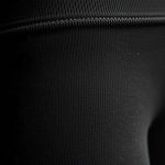 Close-up of the Merino Wool fabric and stitching on black petite yoga pants, highlighting texture and quality.