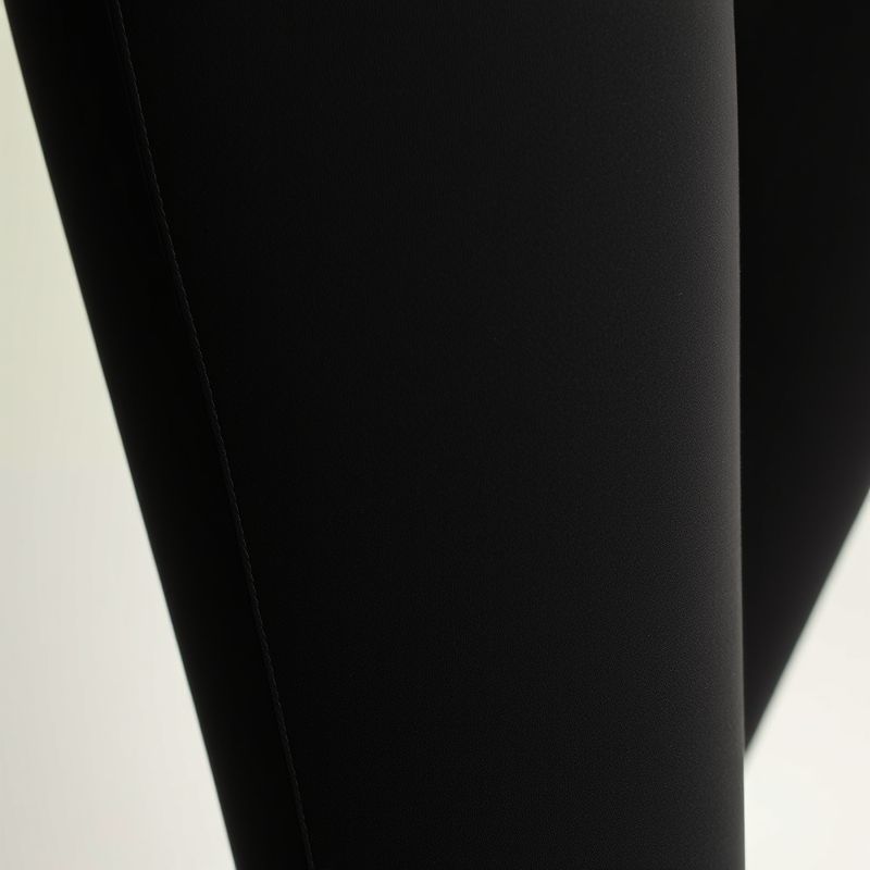 pollinations-black-wide-leg-yoga-pants-3-446057 Close-up of black wide leg yoga pants scrunch bum flare leggings, showcasing Egyptian Cotton fabric texture and stitching detail.