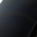 Close-up of the black yoga flare pants bamboo fabric texture and stitching detail.