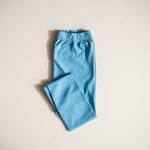 Sky Blue bamboo yoga flare pants from Australia, neatly folded in a flat lay.