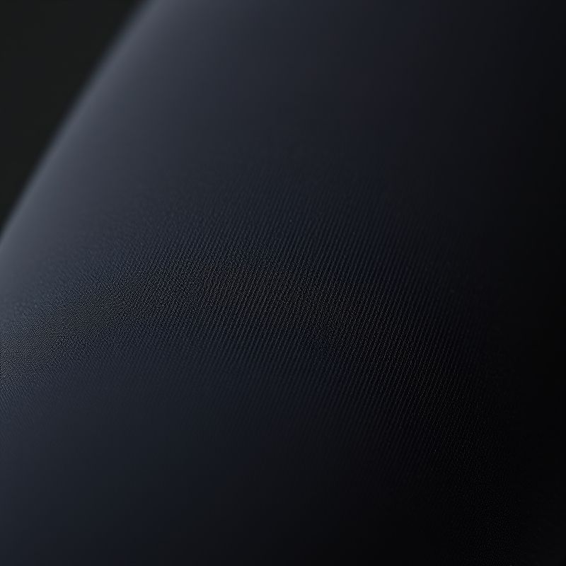 pollinations-black-yoga-pants-3-733432 Close-up of high-waisted black yoga pants showing fabric texture and stitching detail for women.