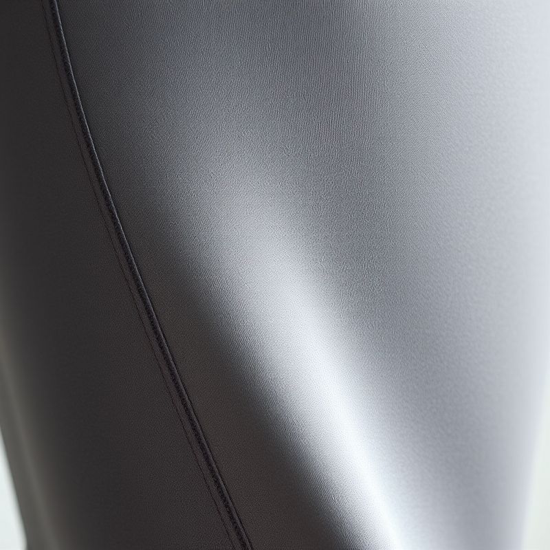 pollinations-flare-active-pants-3-794118 Close-up of grey flared leggings fabric, highlighting Silk Blend texture and stitching of flare active pants.