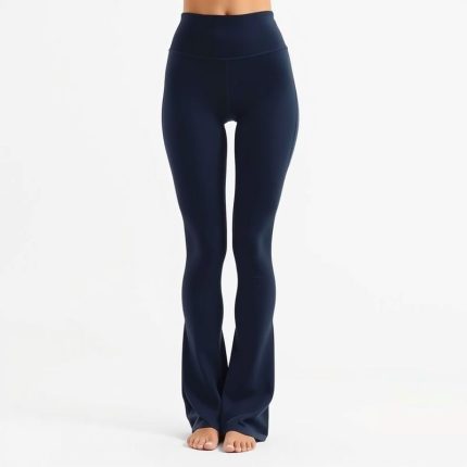 Navy blue flare black yoga pants, high waisted gym leggings on white background, hyperrealistic studio photo.