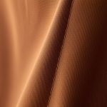 Close-up macro shot of the brown Egyptian Cotton flare yoga pants, highlighting the soft texture and quality stitching.