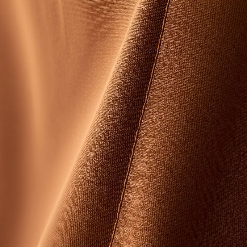 pollinations-flare-yoga-pants-3-68770 Close-up macro shot of the brown Egyptian Cotton flare yoga pants, highlighting the soft texture and quality stitching.