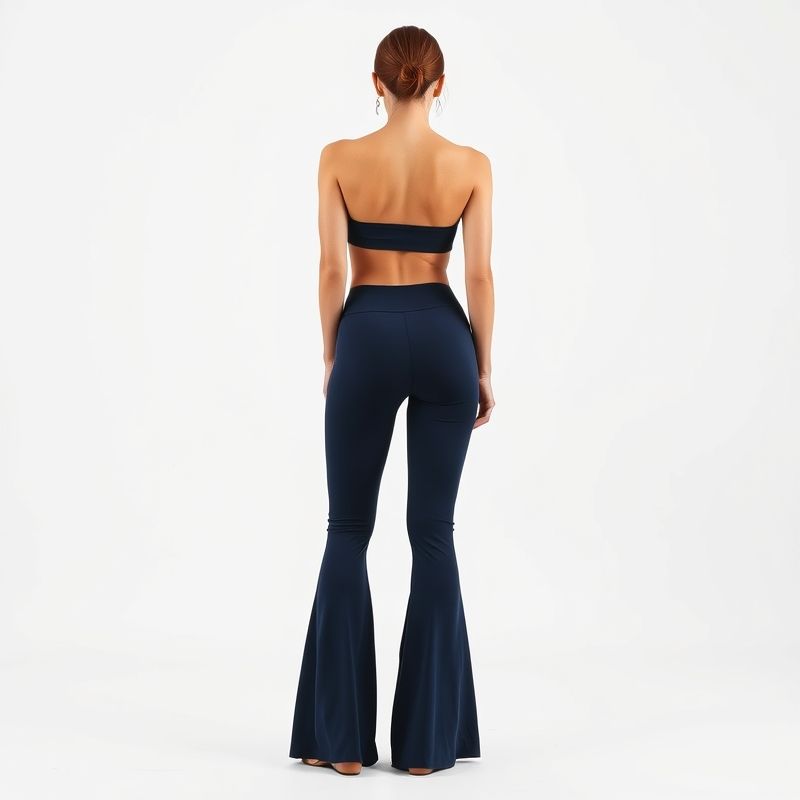 pollinations-flare-yoga-pants-6-636883 Back view of a model in navy blue flare yoga pants on a white background.