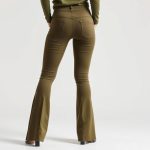 A model wearing olive green leggings with pockets for women, flared leggings petite, back view on white background.
