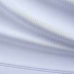 Close-up of the long sleeve yoga top high impact racerback bra fabric, showing texture and stitching in polyester-cotton blend.