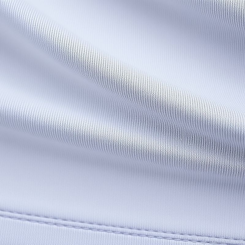 pollinations-long-sleeve-yoga-top-3-990397 Close-up of the long sleeve yoga top high impact racerback bra fabric, showing texture and stitching in polyester-cotton blend.