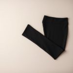 Black scrunch bum leggings | flared leggings Australia, neatly folded in flat lay on a neutral background.