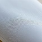 Close-up of high-quality fabric and stitching on straight leg yoga pants for women, showcasing texture and material detail.