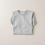 Flat lay of the Heather Grey organic cotton wrap top australia folded on a clean surface.