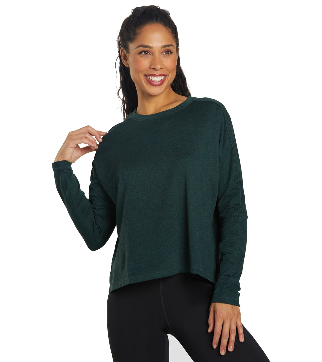 Girlfriend Collective RESET Long Sleeve in moss green draped on a hanger